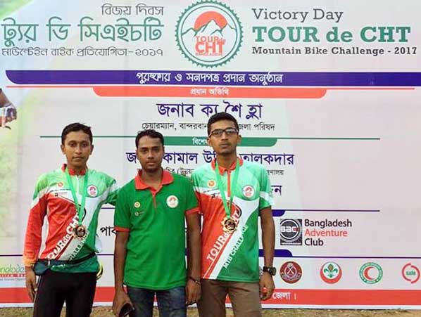 Two winners of cycling competition Arif Nur amd Mahmudul Hasan posed for a photo session at the prize distribution programme organised on the occasion of the Victory Day by CHT Affairs Ministry and Bangladesh Adventure Club recently.