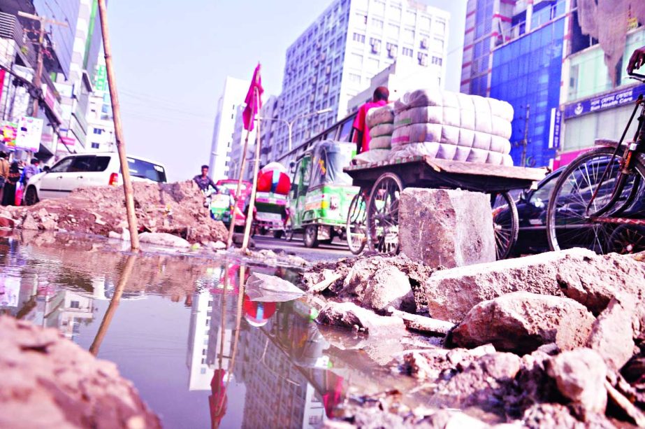 Main thoroughfare in Uttar Badda area still in dilapidated condition as road digging continues for utility services. Where as, this long busy route was repaired a few days ago. Drainage water being stagnant. Cracks and bricks also lying there, creating o