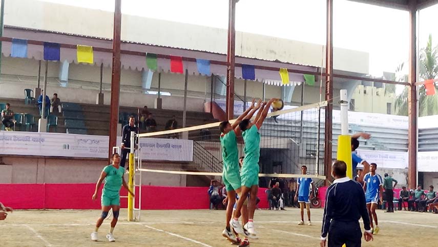 A moment of the match of the Shahjalal Islami Bank Limited Victory Day Volleyball Competition between Bangladesh Army and Bangladesh Police at Volleyball Stadium on Saturday.