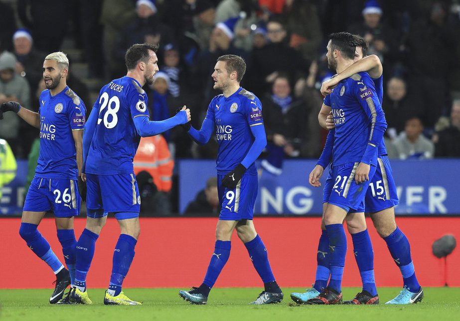 Leicester City's Jamie Vardy (center) celebrates with teammates after scoring his side's first goal of the game during their English Premier League soccer match against Manchester United at the King Power Stadium, Leicester, England on Saturday.