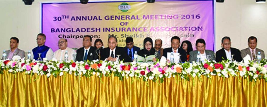 Sheikh Kabir Hossain, President, Bangladesh Insurance Association addressing its 30th Annual General Meeting at Dhaka Club on Sunday. Other members of the Executive Committee of Association are also seen in the Picture. The AGM declared that the total pre