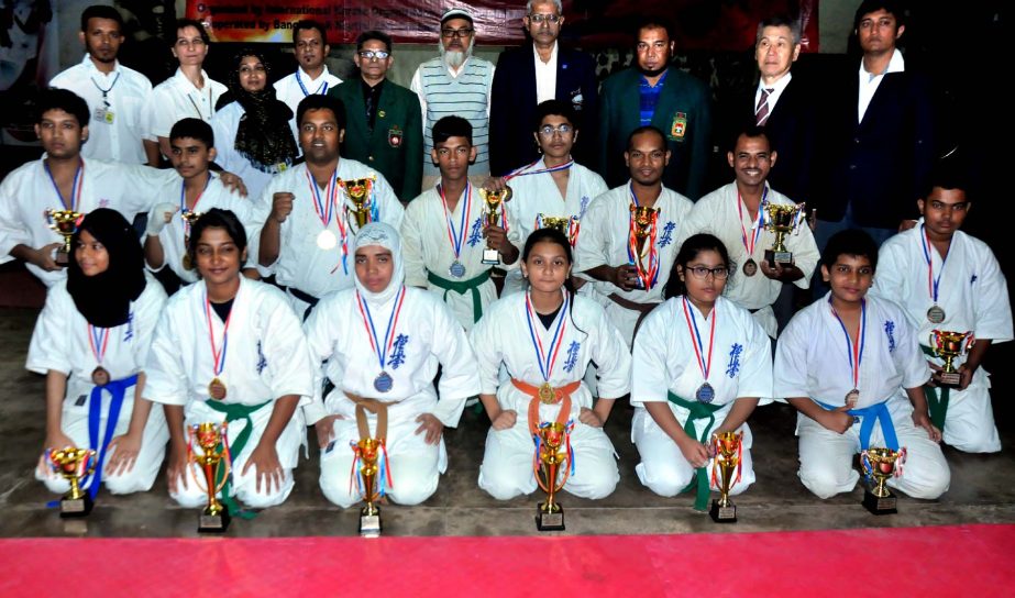 Prize winners of Kheukusin Karate National Competition along with guests pose for photo at the National Sports Council Gymnasium Hall on Monday.