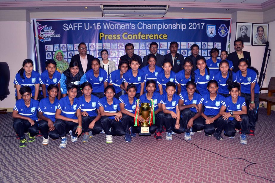 Bangladesh Under-15 Women Football team , who became champion in SAFF Women's Under-15 Championship beating India Under-15 National Women's Football team on Sunday pose for photo with trophy and guests at the BFF House on Monday.