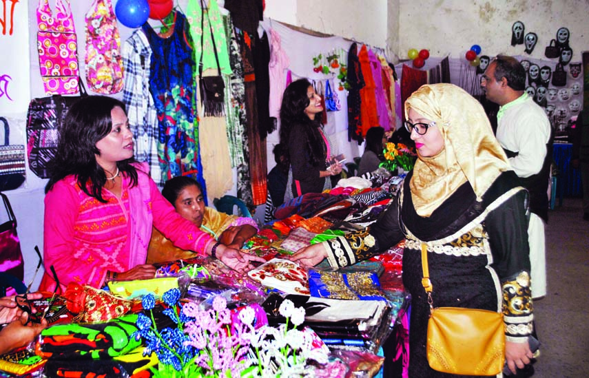 Visitors at the handicrafts exhibition organised by Nakshi Katha Juba Mahila Samaj Unnayan Sangstha at the Jatiya Press Club on Tuesday.