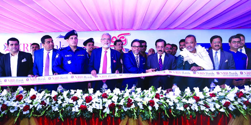 Sheikh Fazlul Karim Selim, MP of Gopalgonaj-2 constituency inaugurating the 34th branch of NRB Bank Limited at Ghonapara in Gopalganj on Sunday. Mohammad Mizanur Rahman, MP of Khulna, Mohammad Mahtabur Rahman, Chairman, Md. Mehmood Husain, Managing Direct