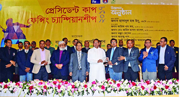 President of Bangladesh Fencing Federation Shoeb Chowdhury handing over a reception crest to Minister for Information Hasanul Haq Inu at the inaugural programme of the President Cup Fencing Championship at the Shahheed Suhrawardy Indoor Stadium in the cit