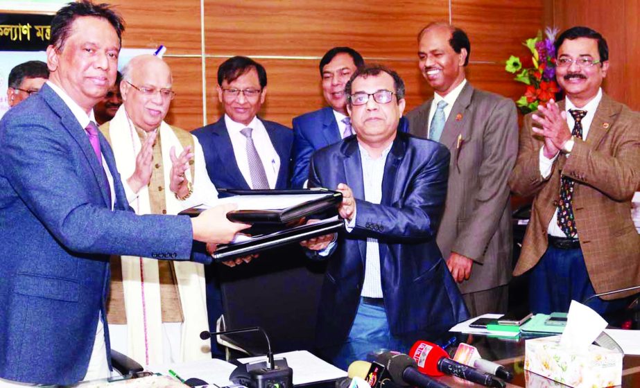 Health and Family Welfare Minister Mohammad Nasim along with others at deal signing ceremony for the construction of 36 community clinics financed by India at the ministry on Thursday.