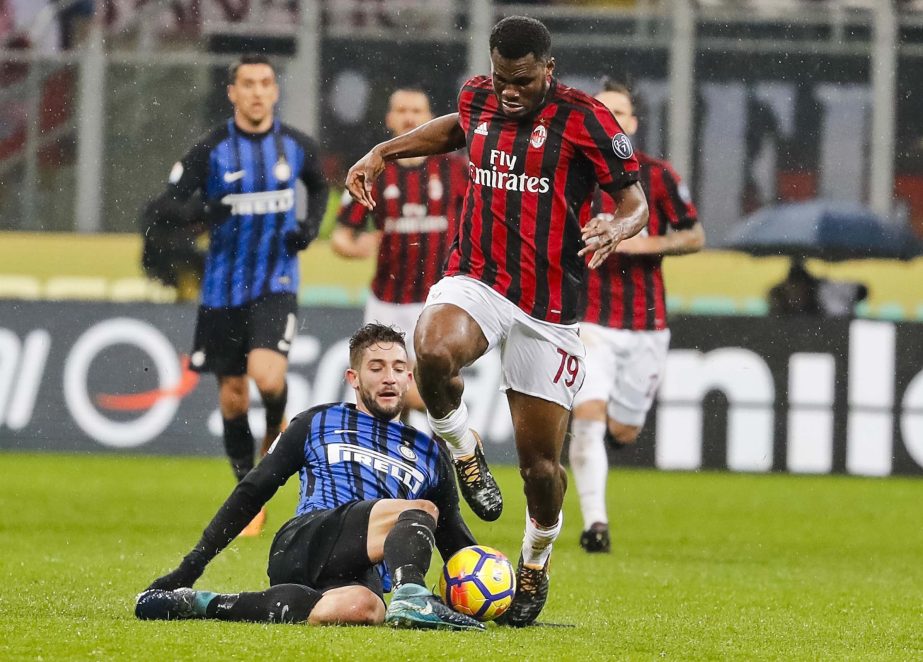 AC Milan's Franck Kessie (right) is tackled by Inter Milan's Roberto Gagliardini during an Italian Cup quarter-final soccer match between Milan and Inter Milan at the San Siro stadium in Milan, Italy on Wednesday.
