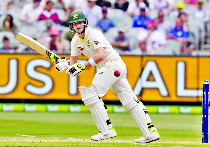 Australia's Steve Smith pulls the ball against England during the fourth day of their Ashes cricket Test match in Melbourne, Australia on Friday.