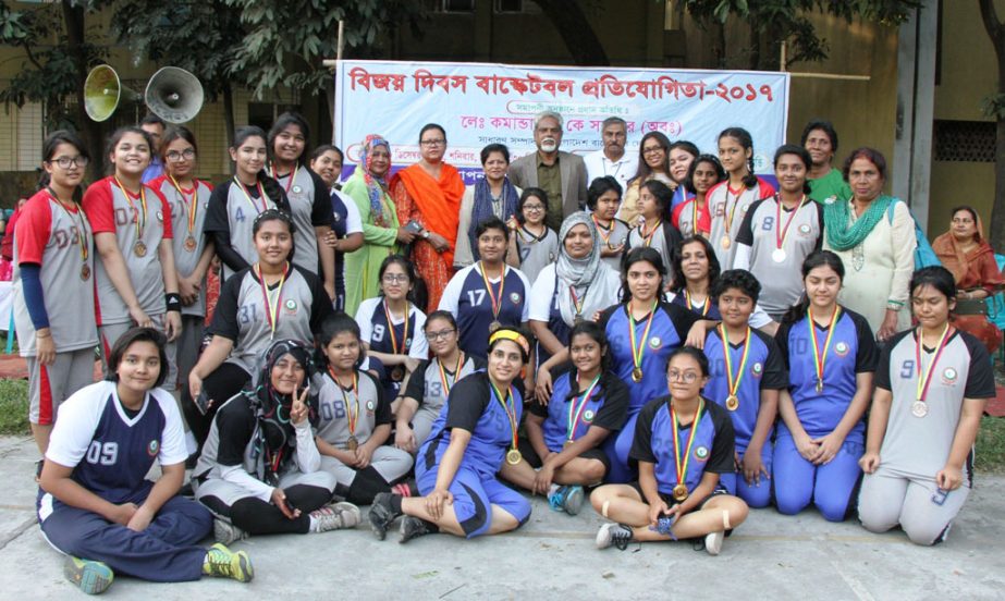 The champions and the runners-up ( Team A & Team B) of the Victory Day Basketball Competition with the guests and officials of Bangladesh Women Sports Federation pose for a photo session at Basketball Court in the Sultana Kamal Women's Sports Complex in