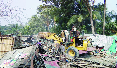 BAGERHAT: Illegal structures at Naopara point on Mongla - Khulan Highway have been evected by LGED, Bagerhat recently.