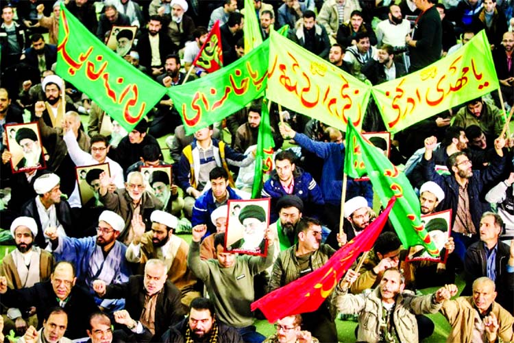 Iranians chant slogans as they march in support of the regime near the Imam Khomeini grand mosque in Tehran on Saturday.