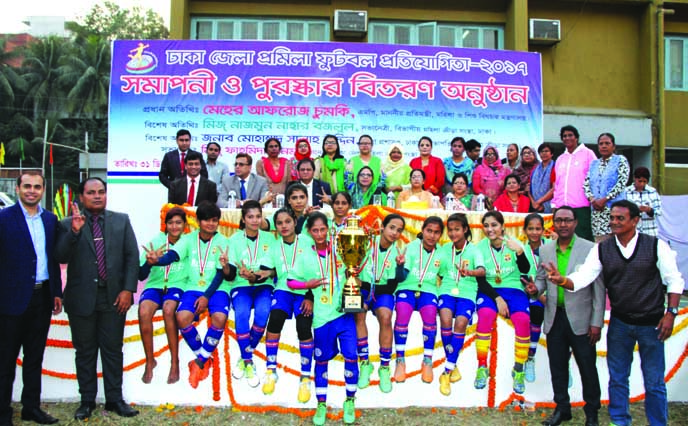 Members of Keraniganj Green team, the champions of the Dhaka District Women's Football team with the chief guest State Minister for Women and Children Affairs Meher Afroz Chumki and the other guests and officials of Dhaka District Women Sports Federation