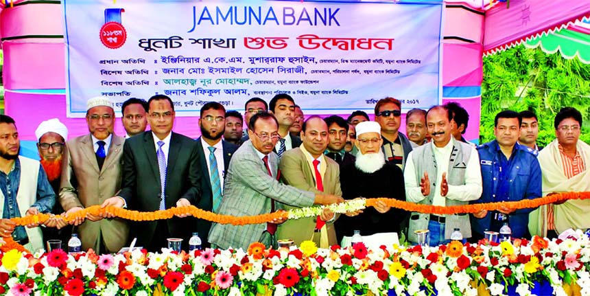 Ismail Hossain Siraji, Chairman of Jamuna Bank Limited, inaugurating its 118th branch at Dhunot Sadar Upazila in Bogra recently. Engr. AKM Mosharraf Hossain, Chairman of Risk Management Committee of the bank and Nur Mohammad, Chairman of Jamuna Bank Found