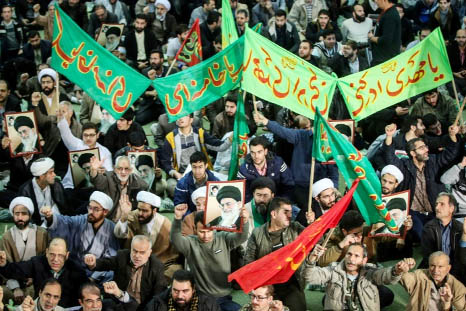 Iranians chant slogans in support of the regime as they march in Tehran.