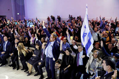 Likud party members vote during a Likud Central Committee meeting in Airport City, Israel.