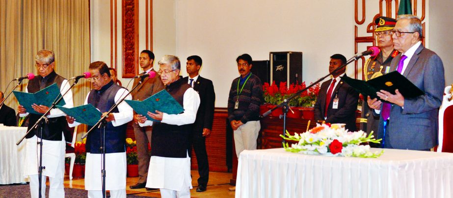 President Abdul Hamid administering oath to three new ministers in Darbar Hall of Bangabhaban on Tuesday. Press Wing, Bangabhaban photo