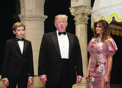 US President Donald Trump-pictured here at a New Year's party at his Florida resort, flanked by son Barron and wife Melania-kicked off 2018 with a tweet sharply critical of Pakistan on Monday.