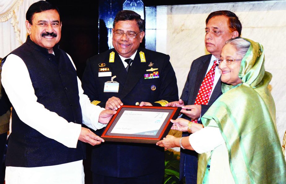 Shipping Minister Shajahan Khan MP handing over a certificate of the UK- based International Rating Organisation Llyod to the Prime Minister Sheikh Hasina in which Chittagong Port was ranked 71st among 100 sea ports at the Prime Minister's Office yeste