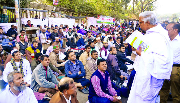 Columnist Abul Maksud of Nagorik Samaj consoling and supporting the teachers demand as they were continuing hunger strike for the 5th consecutive day after 8 days sit-in programme in front of Jatiya Press Club on Wednesday.