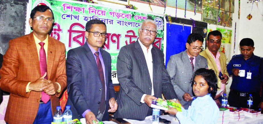 RAMPAL (Bagerhat): Talukder Abdul Khaleq MP distributing new books among the students of Rampal Model Primary School on the occasion of the Free Text Book Festival as Chief Guest recently. Among others, Tushar Kumar Paul, UNO, Rampal Upazila was present