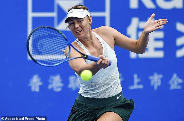 Maria Sharapova of Russia returns the ball during a quarter final match against Zarina Diyas of Kazakhstan at the WTA Shenzhen Open tennis tournament in Shenzhen, South China's Guangdong Province on Thursday.