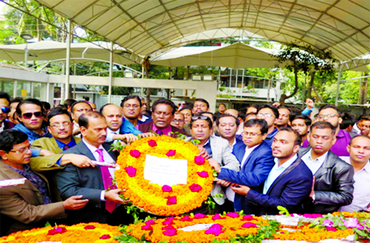 Newly appointed Director of Dhaka Shishu Hospital Prof Dr Abdul Aziz and Director of Bangladesh Shishu Swasthya Institute Prof Dr Syed Shafi Ahmed, along with others placing floral wreaths at the portrait of Bangabandhu in the city's Dhanmondi on Thursda