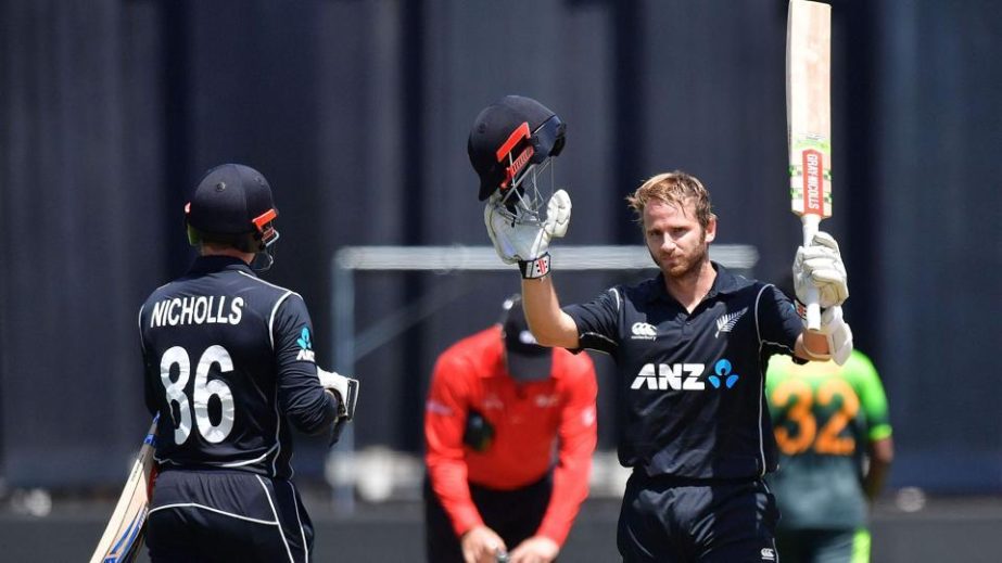 New Zealand captain Kane Williamson (R) celebrates 100 runs with teammate Henry Nicholls during the first One-Day International (ODI) against Pakistan at the Basin Reserve in Wellington on Saturday.