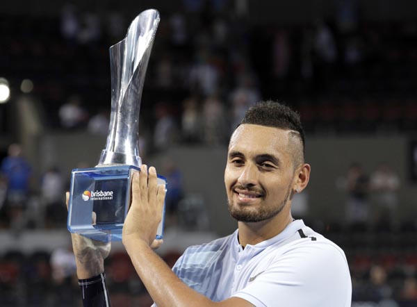 Nick Kyrgios of Australia holds the trophy after winning his final match against Ryan Harrison of the U.S. 6-4, 6-2, during the Brisbane International tennis tournament in Brisbane, Australia on Sunday.