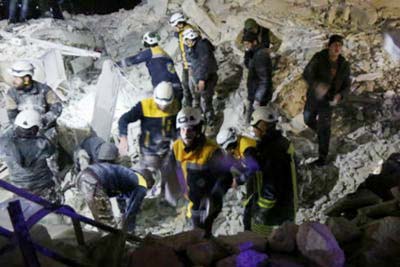 Syrian emergency personnel search for victims following an explosion in a rebel-held area of IDLIB.