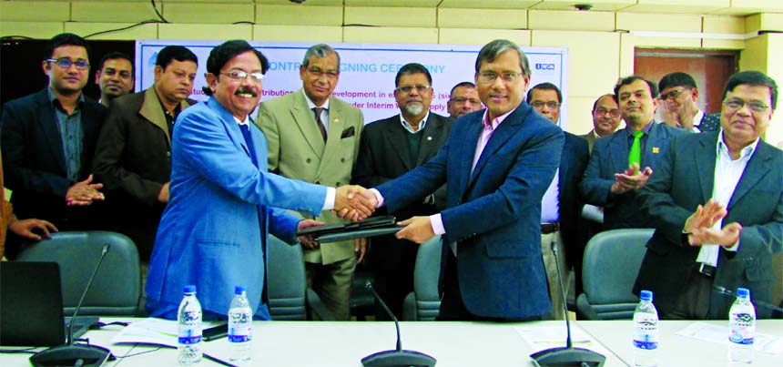 Md Akhtaruzzaman, Additional Chief Engineer and Project Director of Interim Water Supply Project of Dhaka WASA and SM Mahbubur Rahman, Water Resource Planning Director of Institute of Water Modelling (IWM), exchanging a contract signing documents at WASA