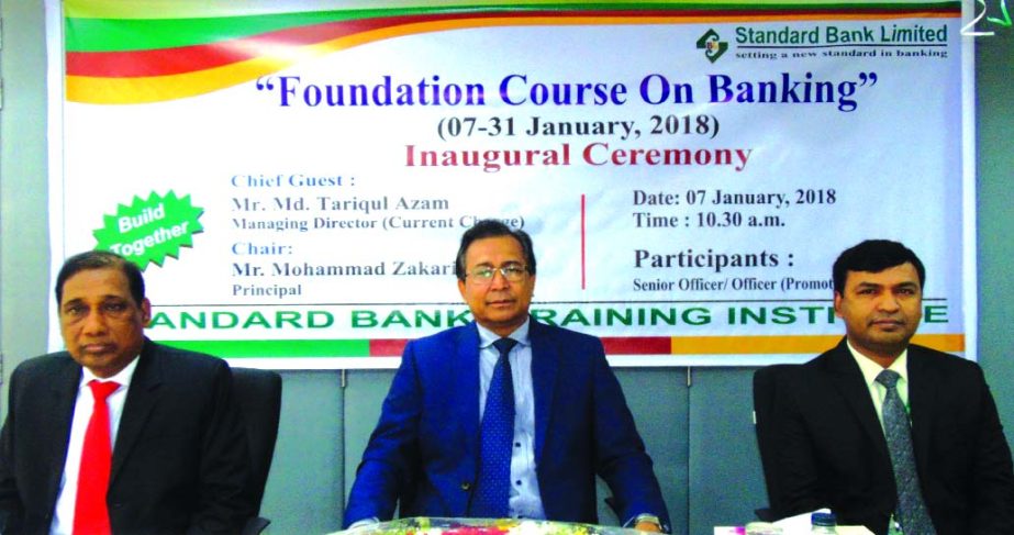 Md. Tariqul Azam, Managing Director (CC) of Standard Bank Limited, presiding over a four-week long training on "Foundation Course on Banking" at the banks Training Institute in the city on Sunday. Md. Zakaria, Principal and Md. Amzad Hossain Fakir, Facu