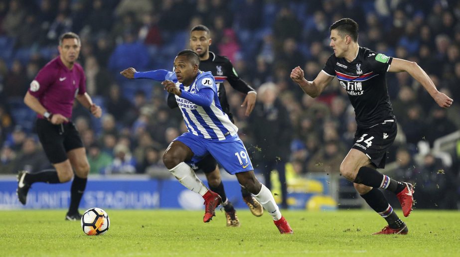 Brighton & Hove Albion's Jose Izquierdo breaks through Crystal Palace's Martin Kelly, right, and Jairo Riedewald, during their English FA Cup, Third Round soccer match at the AMEX Stadium in Brighton, England on Monday.