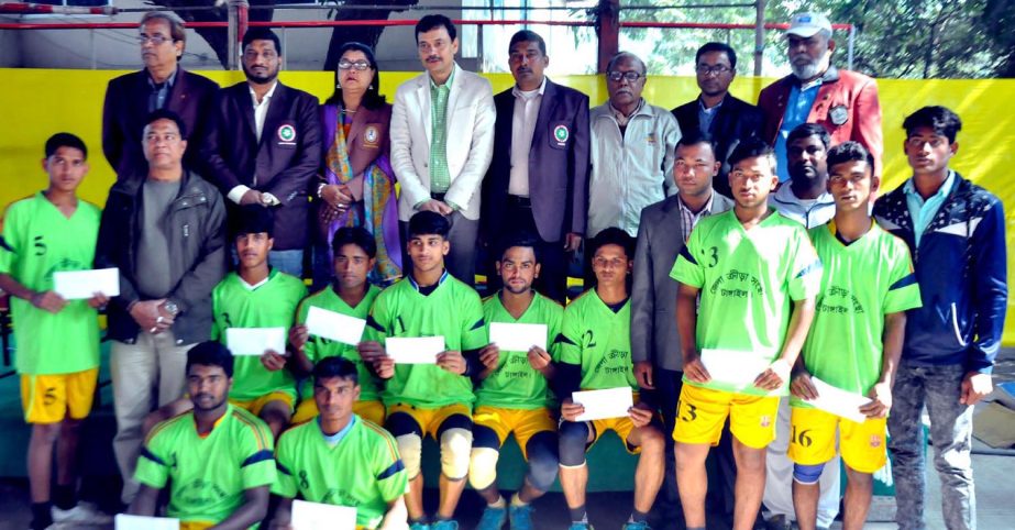 Members of Tangail District Sports Association team, the champions of the Kabaddi Competition of the Dhaka Divisional phase of the Bangladesh Youth Games with the guests and officials of Bangladesh Kabaddi Federation pose for a photo session at the Kabadd