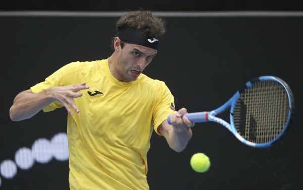 Albert Ramos-Vinolas of Spain plays a forehand to Paolo Lorenzi of Italy during their men's singles match at the Sydney International tennis tournament in Sydney on Wednesday.