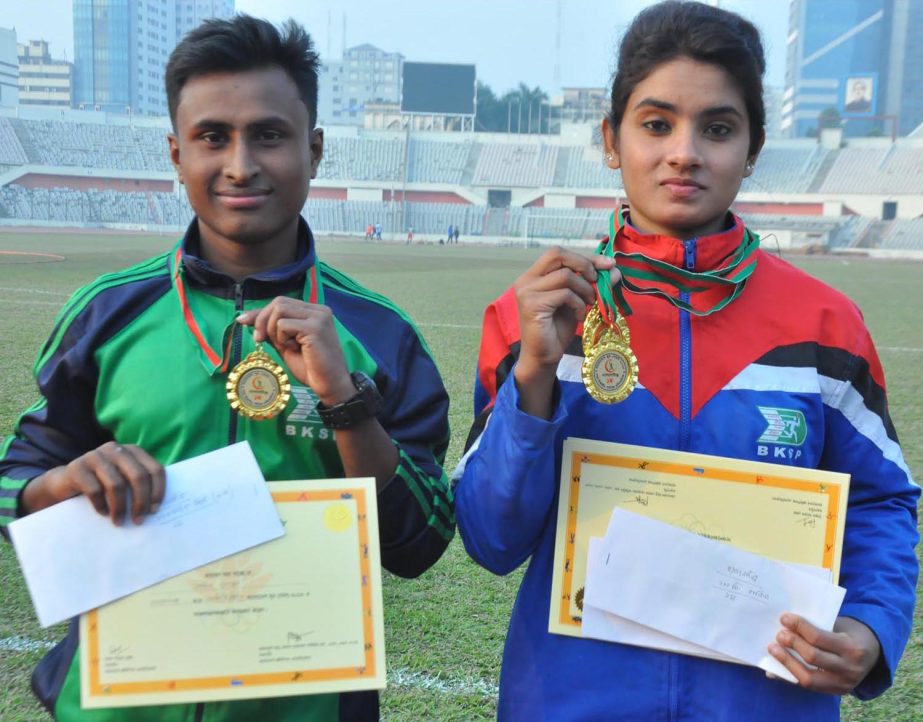 Nadim Molla (left) of Narayanganj District and Disha Sultana of Manikganj District, the fastest man and fastest woman of the Dhaka Divisional phase of the Bangladesh Youth Games showing their medals at the Bangabandhu National Stadium on Wednesday.