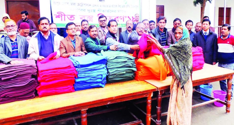 RANGPUR: Mustafa Sohrab Chowdhury Titu , President, Rangpur Chamber of Commerce and Industry distributing blankets among the cold- hit people at RCCI School and College ground on Tuesday.
