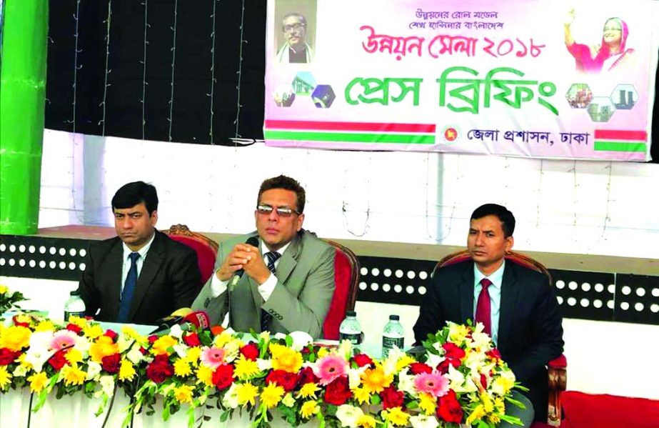 Mohammed Salah Uddin, Dhaka District Commissioner, addressing at a press conference marking the 3-daylong 'Development Fair' at Shilpakala Academy in the city on Wednesday. Mozibor Rahman, ADC (Gen), Md. Shariful Alam Tanvir, Assistant Commissioner (Lan