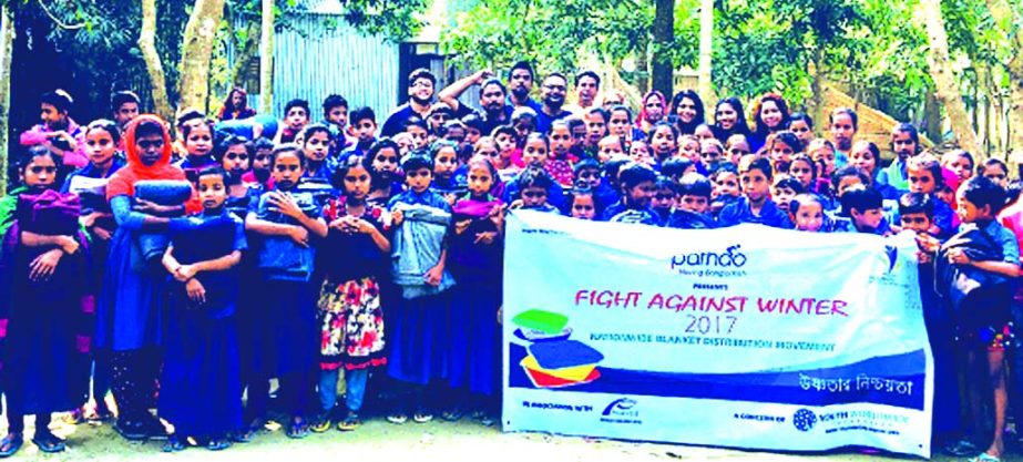 Tahmid Kamal, President of Youth's Voice (a concern of Youth Worldwide Foundation) distributing blankets among the cold affected people at Panchagarh recently. The organization has already distributed 2500 blankets in different places in Rajbari, Dinajpu