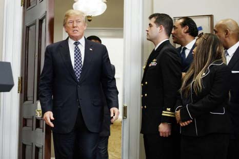 President Donald Trump arrives to an event to honor Dr. Martin Luther King Jr., in the Roosevelt Room of the White House on Friday in Washington.