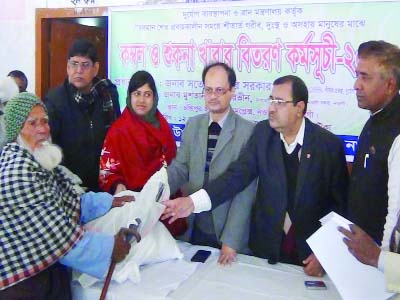 NAOGAON: Satyendra Kumar Sarkar, Joint Secretary and Project Manger , Disaster Management Directorate distributing blankets and dry food among poor people at Chondipur Union Parishad premises on Saturday.