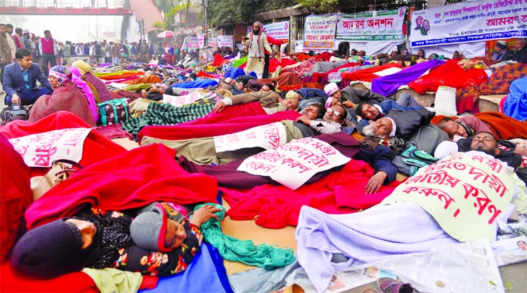 Ebtedayee Madrasa teachers continuing hunger strike unto death on the 7th day with their families including kids in front of Jatiya Press Club on Sunday.
