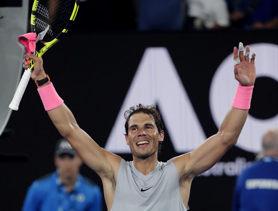 Spain's Rafael Nadal waves after defeating Victor Estrella Burgos of the Dominican Republic during their first round match at the Australian Open tennis championships in Melbourne, Australia on Monday.