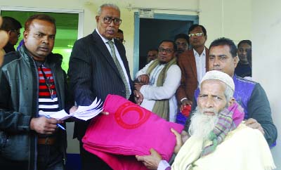 JALDHAKA(Nilphamari): Prof Golum Mustafa MP giving a crest to Engineer Harun- ur- Rashid of LGED for his outstanding contributions on rural infrastructure development at the concluding day of the Development Fair at Jaldhaka Upazila on Saturday.