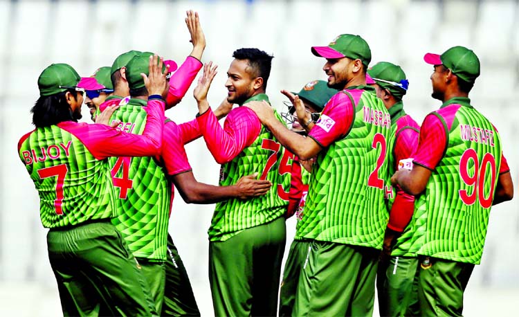 Players of Bangladesh celebrate the dismissal of the last wicket of Zimbabwe during their opening match of the Tri-Nation ODI series at the Sher-e-Bangla National Cricket Stadium in the city's Mirpur on Monday.