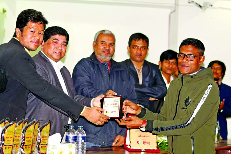 Md Jamal Uddin, recommended cadre (admin) for 36th Bangladesh Civil Service (BCS) receiving crest from the guests at a reception programme for newly recommended 36th BCS cadres and students of Bhola who admitted in Dhaka University under 2017-18 session