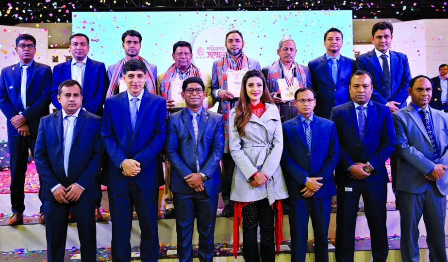 Ahsan Khan Chowdhury, Chairman and CEO of PRAN-RFL Group, poses with the participants at its Dealers' Conference at RFL Industrial Park at Kaliganj in Gazipur on Sunday. More than 2500 distributors, engaged to serve Sera, Sticky, Saudi, Comfy, Playtime,