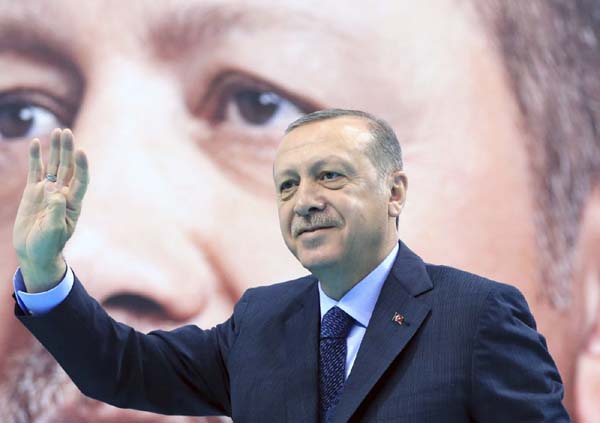 Turkey's President Recep Tayyip Erdogan waves to supporters of his ruling Justice and Development Party (AKP), at a rally in Elazig, eastern Turkey.