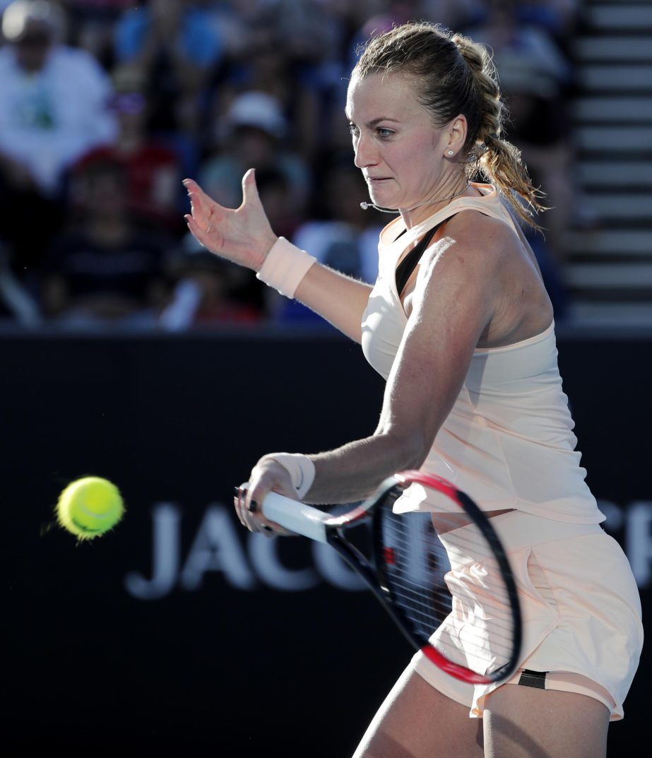Petra Kvitova of the Czech Republic makes a forehand return to Germany's Andrea Petkovic during their first round match at the Australian Open tennis championships in Melbourne, Australia on Tuesday.