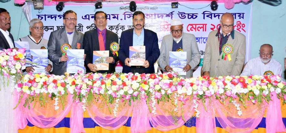 CCC Mayor A J M Nasir Uddin unveiling the cover of the Souvenir at the re-union of Chandgaon NMC Adarsho High School organised by the former Students' Parishad of the School on Wednesday.